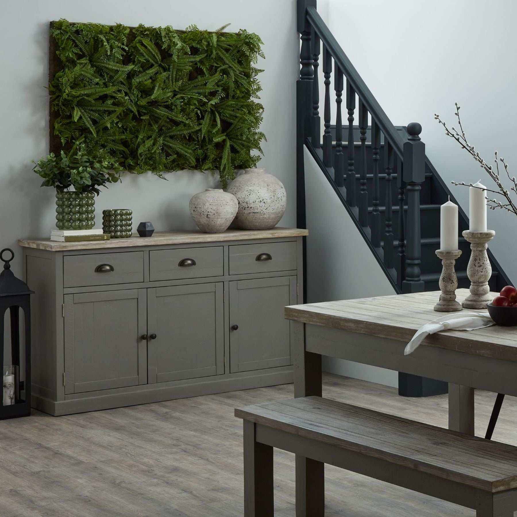 Stone-textured Shola Vase with organic design on a wooden console in a modern interior setting.