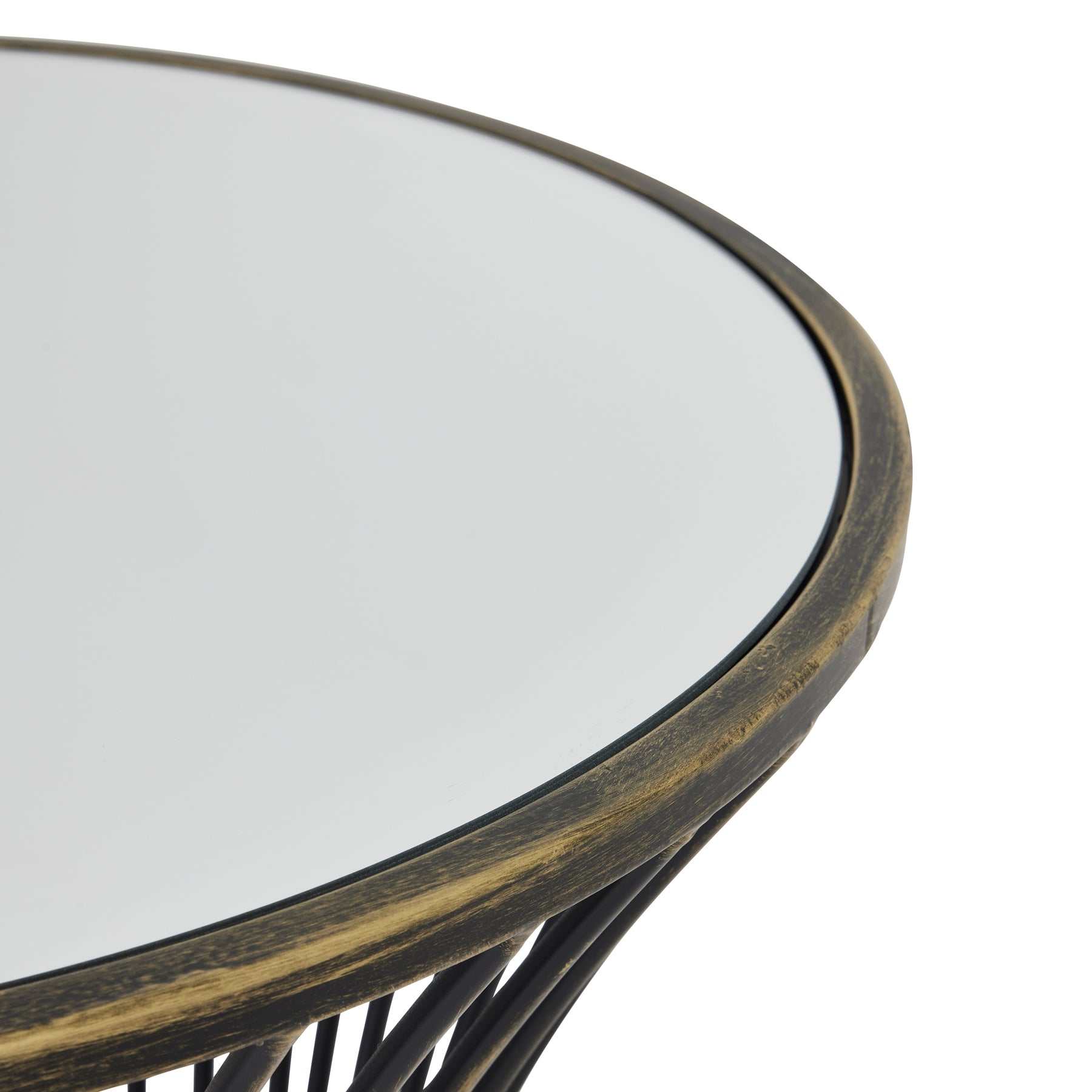 Contemporary mirrored side table with brass metal frame and concave design.
