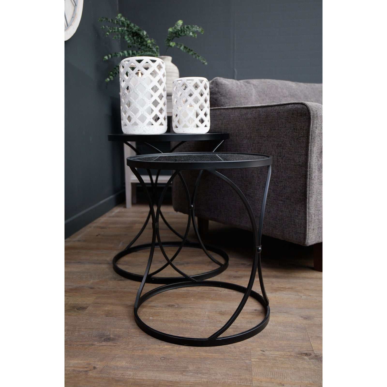 Sleek black metal and mirror Lola side tables, adding contemporary style and sophistication to any room.