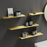 Safia Shelves in gold finish, wall-mounted in a kitchen setting for stylish organization and display.
