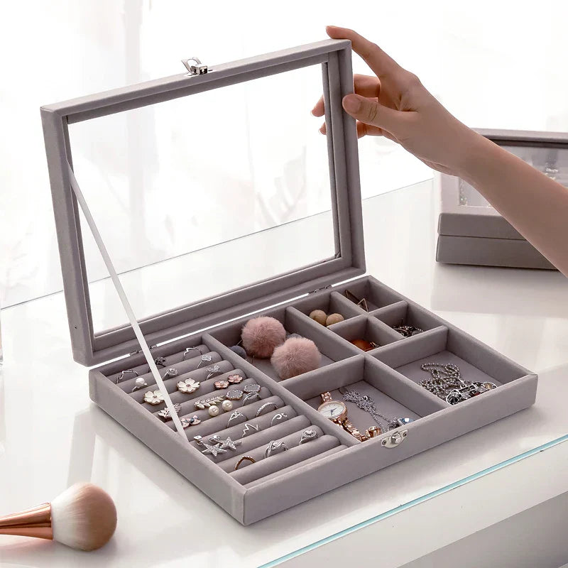 Velvet glass jewelry box for organizing and displaying jewelry.