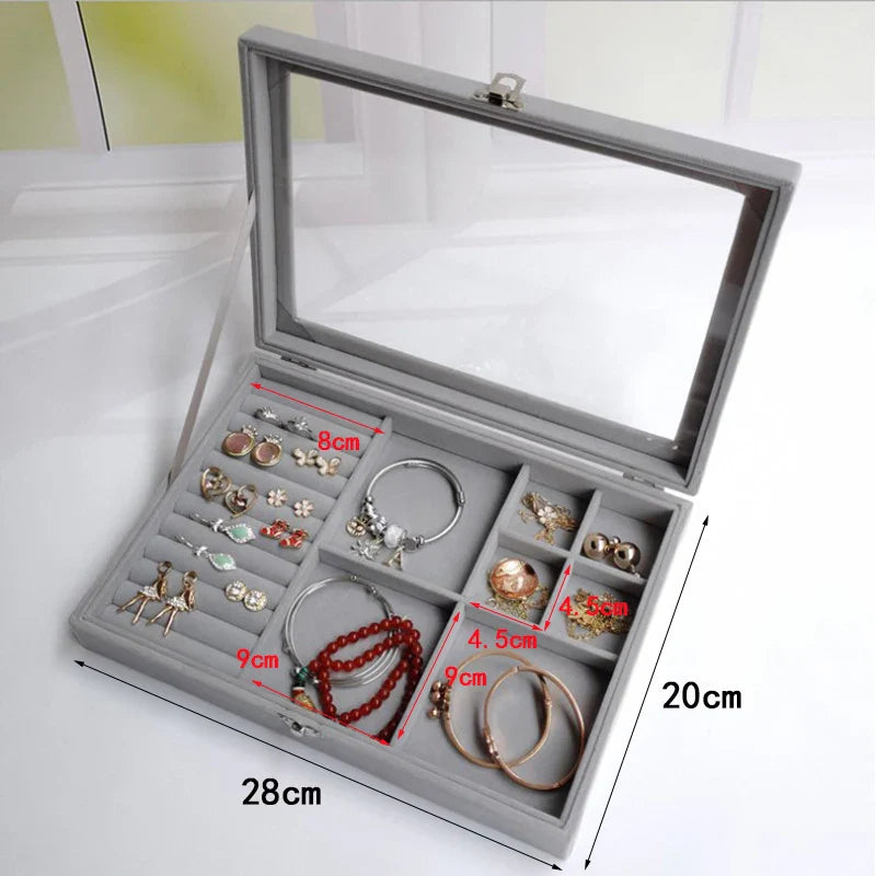 Velvet glass jewellery box with organizers for storing and displaying accessories.