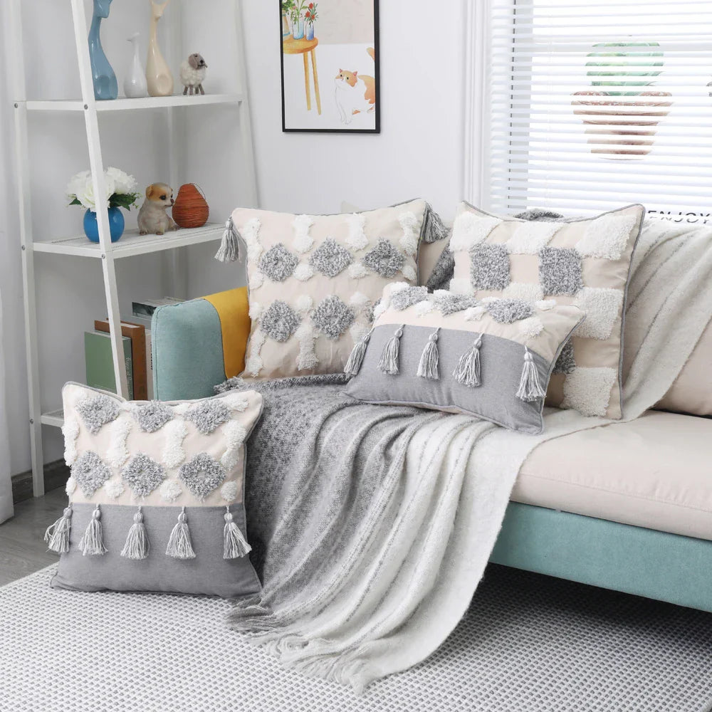 Moroccon style pillow cases with intricate designs on a sofa setting.