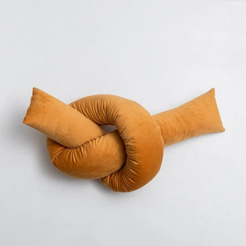 Cyril Cushions with playful knot design for children's room decor.