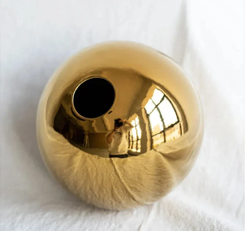Gold spherical Nuala Vase for elegant home decor.