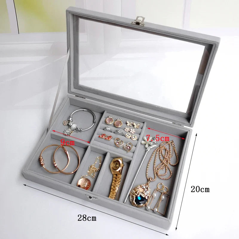 Velvet glass jewellery box with multiple compartments for organizing accessories.