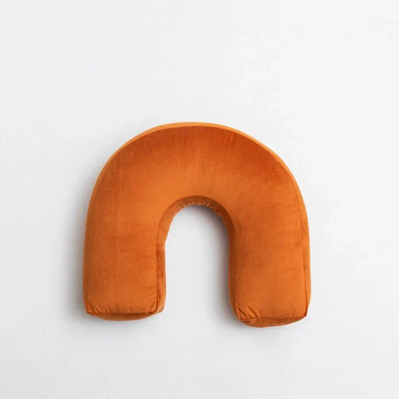 Cyril Cushions - playful and cute orange pillow with a unique design for children's rooms.