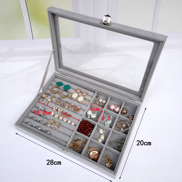 Velvet glass jewellery box with compartments for organizing jewellery.