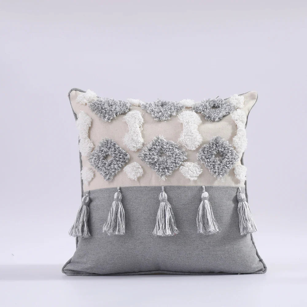 Moroccan style pillow case with intricate patterns and tassels, adding elegance to bedroom decor.