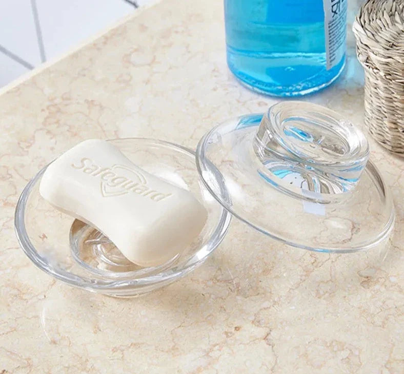 Vishka glass soap dish on bathroom sink for organized cleanliness.