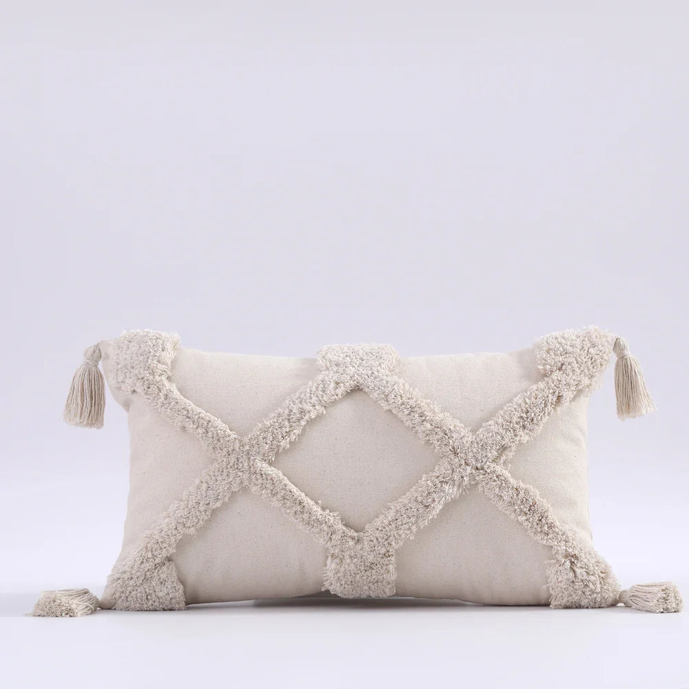 Moroccon style pillow case with intricate patterns and tassels, enhancing bedroom decor.