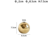 Gold spherical 'Nuala Vase' with measurements, perfect for home decor and floral displays.