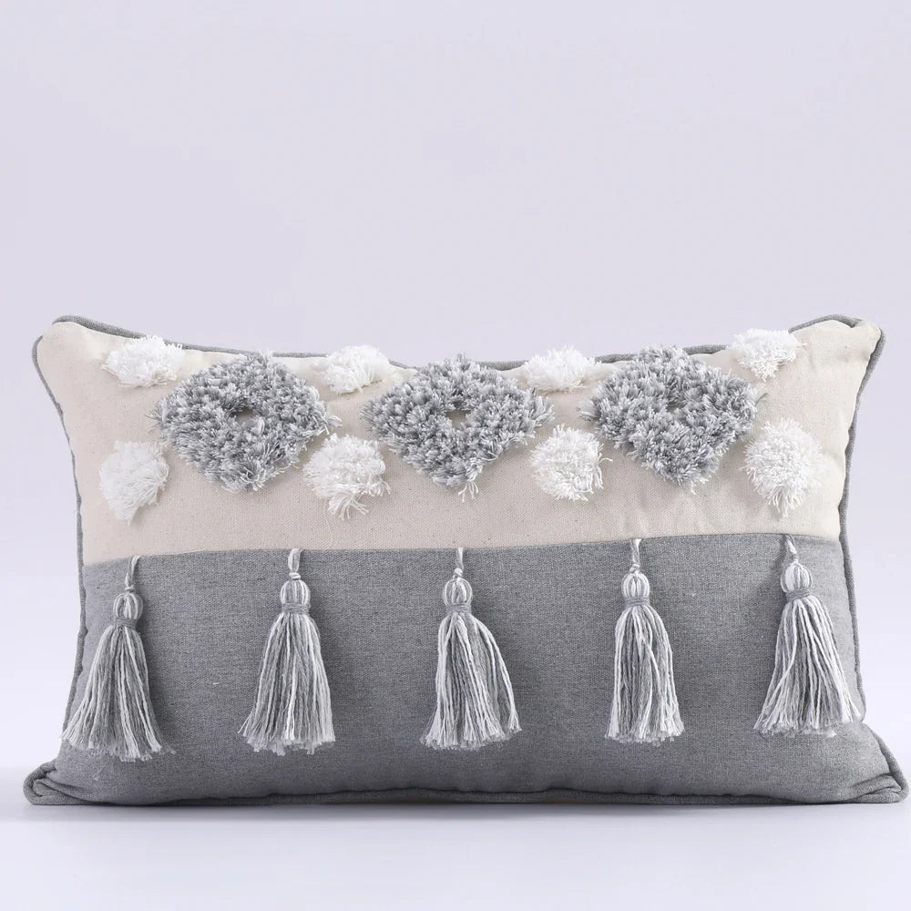 Moroccon style pillow case with intricate patterns and tassels, perfect for elegant bedroom decor.