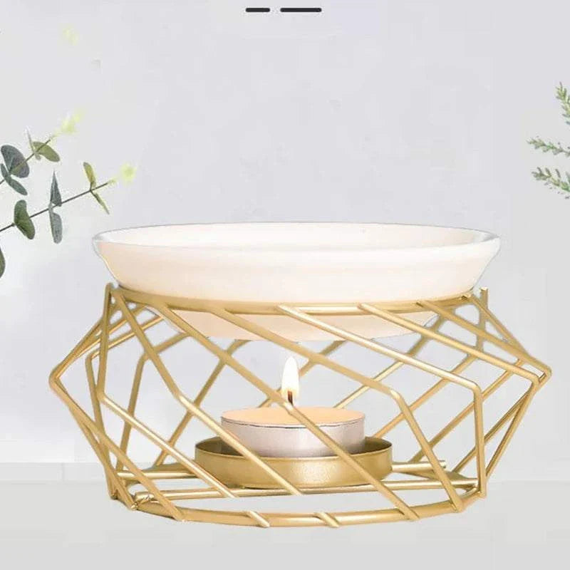 Aromatic Oil Burner with gold geometric design and candle, enhancing home ambiance.