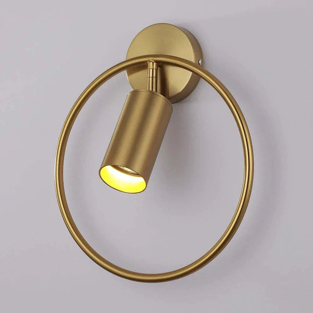 Sleek gold Yao Wall Lamp with circular design and LED lighting.