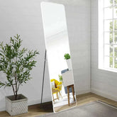 Silver rectangular mirror with a classic metal frame, wall-mounted or freestanding, enhancing home decor in a bright room.