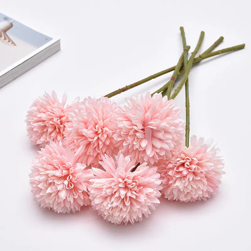 Lifelike pink Celine Faux Dandelion Flower with elegant petals for interior decor.