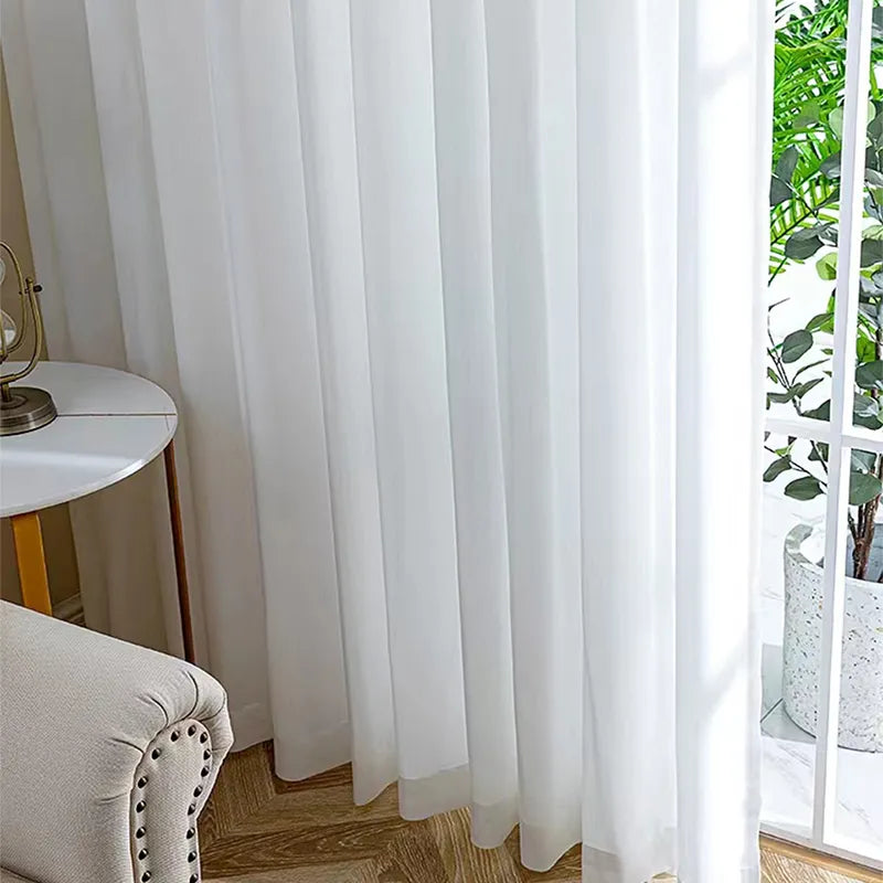 Asazal White Tulle Curtains filtering light in a modern living space.