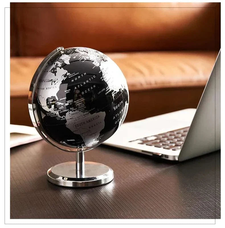 Aya Globes in black displayed on a modern office desk.