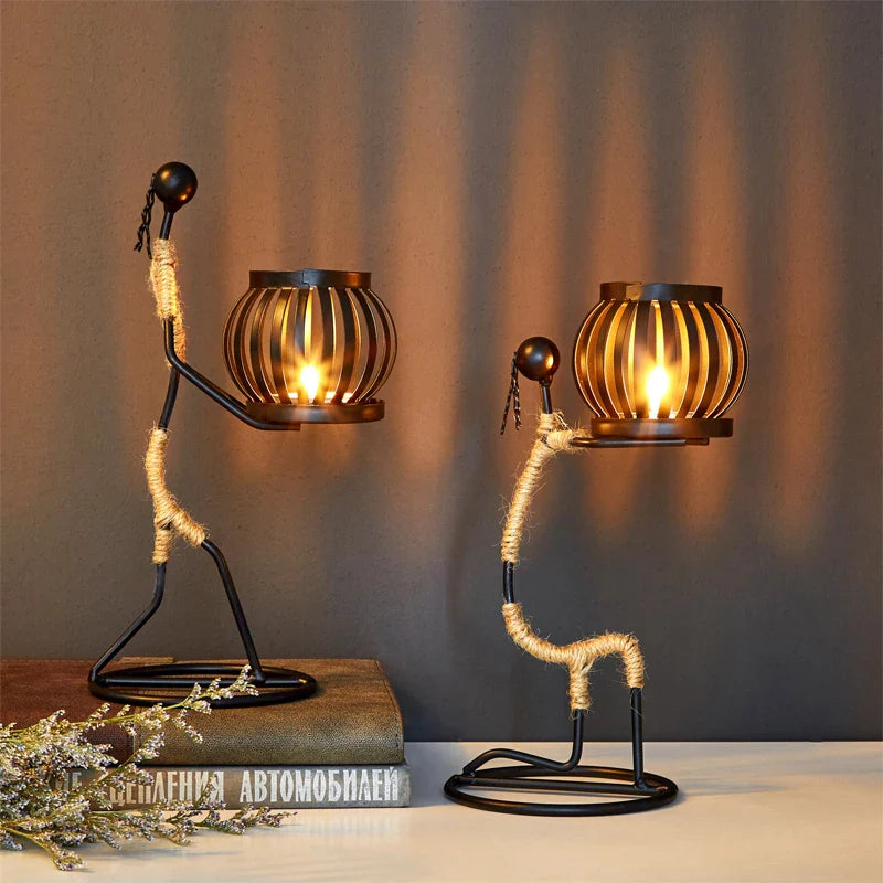 Ewa Candle Holder featuring elegant African woman design with lit candle ambiance.
