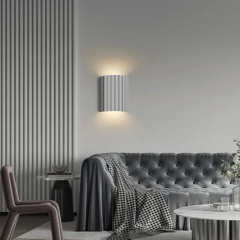 Resin Wall Lamp illuminating a modern living space with grey decor and a Nordic design.