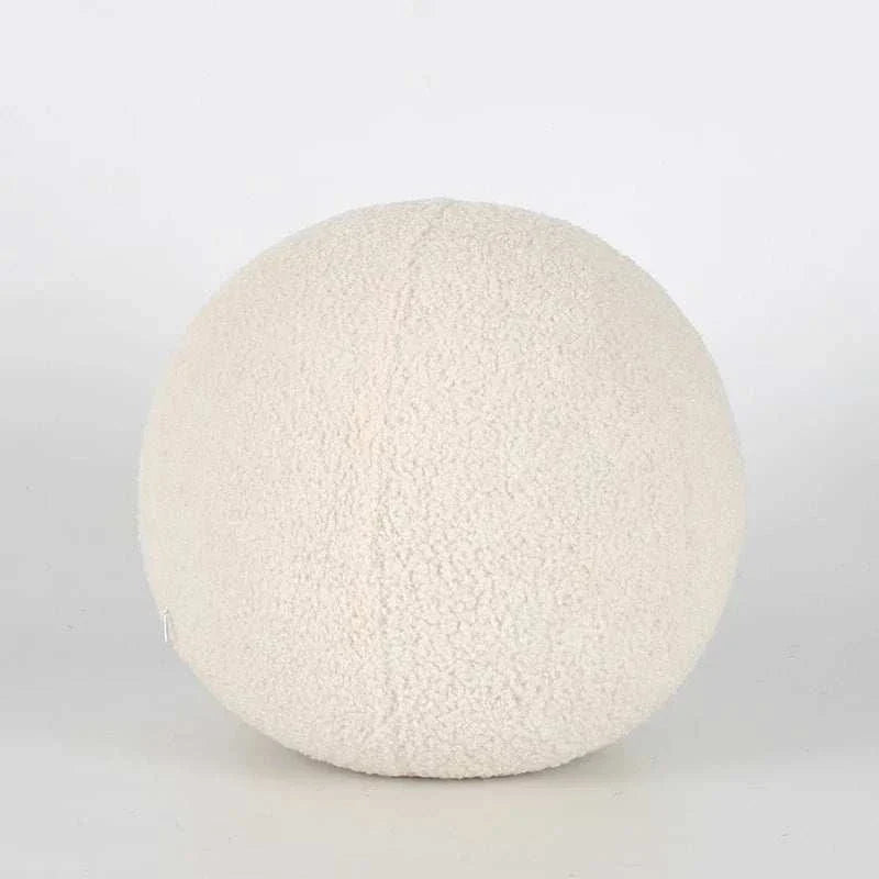 Soft round pillow by Bubble Kiss in neutral color.