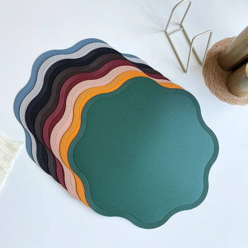 Noah's Placemats in various elegant colors on a dining table.