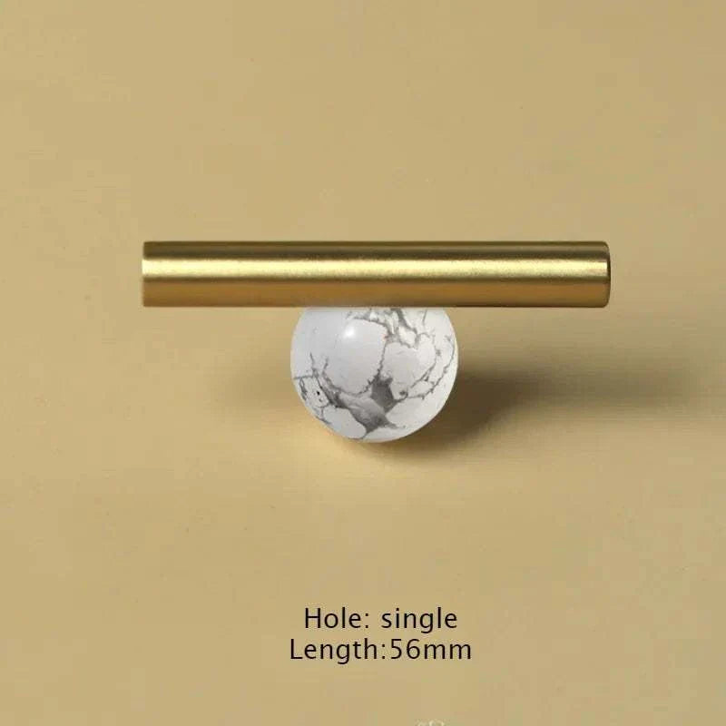 Natural crystal and brass furniture handle for cabinets and drawers.