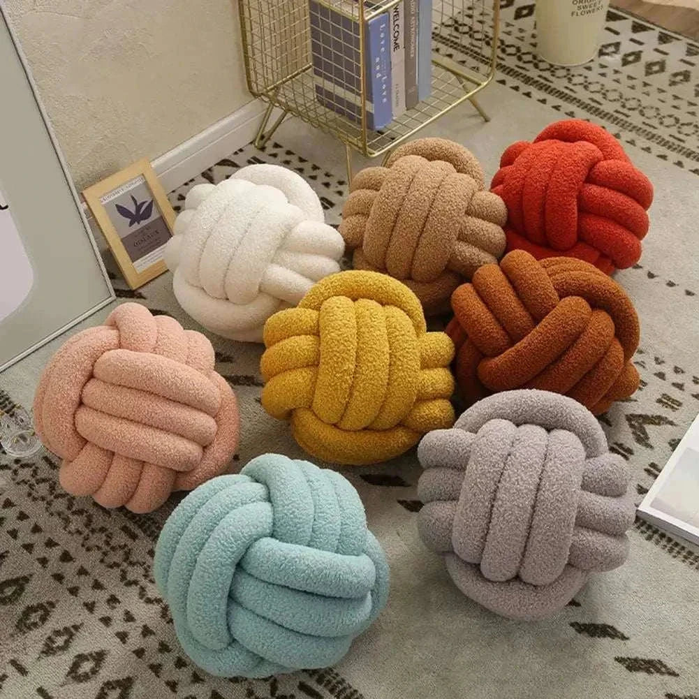 Knotted Ball Pillow for kids' rooms, available in various colors, crafted from soft, durable materials.