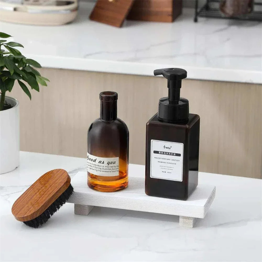 Small wood riser used to elevate items on a desk for ergonomic comfort.