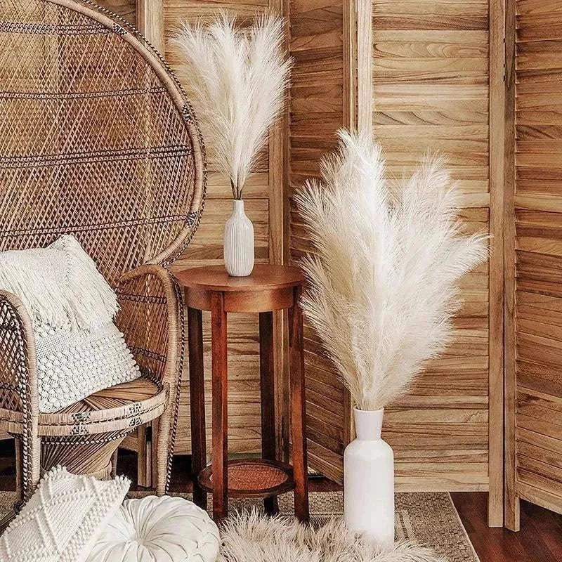 Faux pampas grass arrangement in a stylish boho room setting.