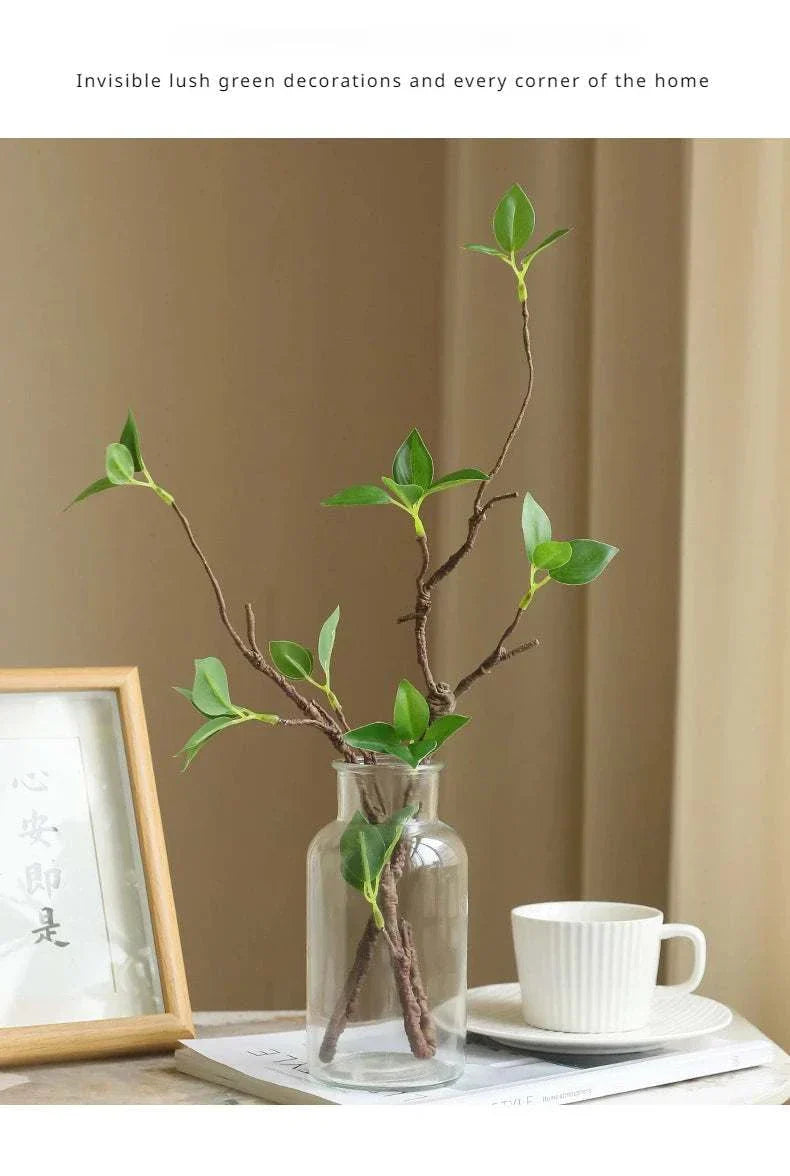 Artificial withered branches in a glass vase, perfect for elegant home decor.