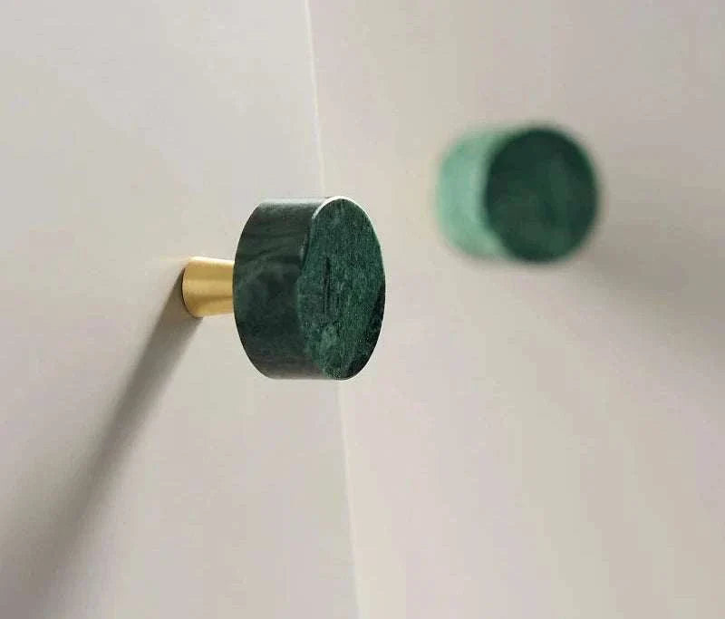 Durable brass door handles with green marble design.