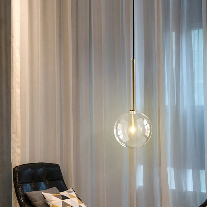 Anji lights hanging LED and glass ball design in stylish room setting.