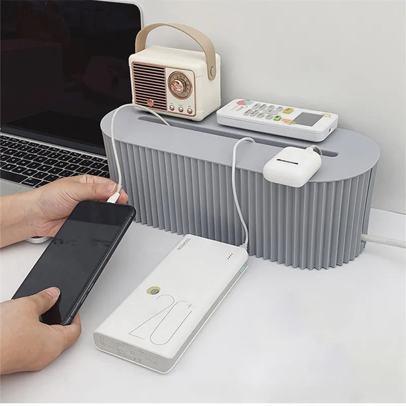Nodu Plug Storage Box keeps cords organized and tidy on a desk.