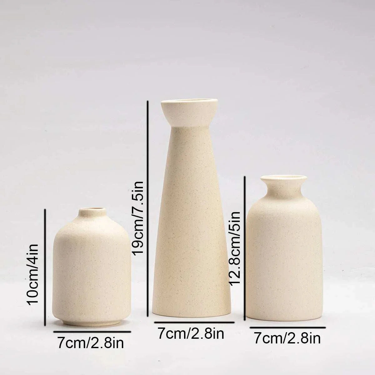 Minimalist Wulf Vases in sleek cream ceramic design.