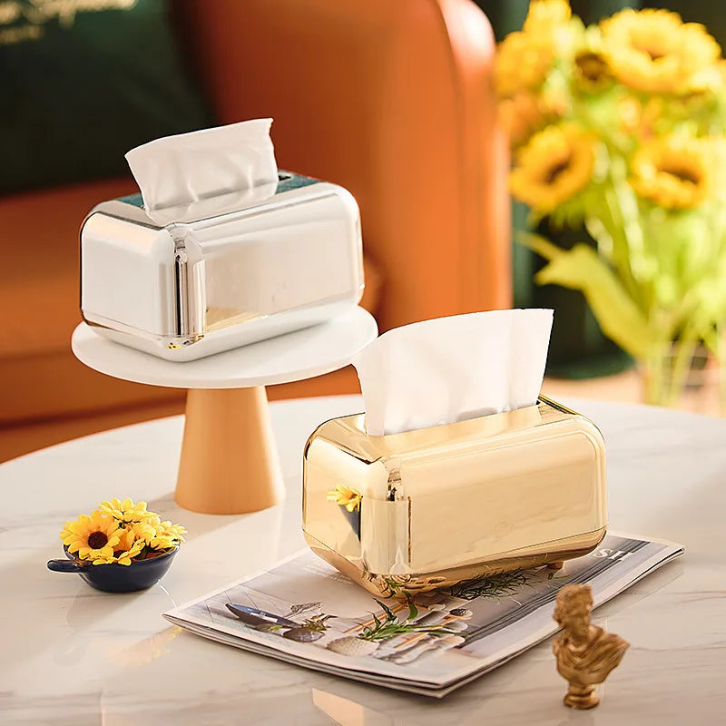 Luxie tissue box with luxurious gold finish, enhancing room elegance.