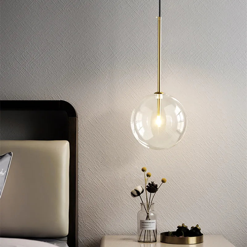 Anji lights hanging LED glass ball illuminating a modern bedroom.