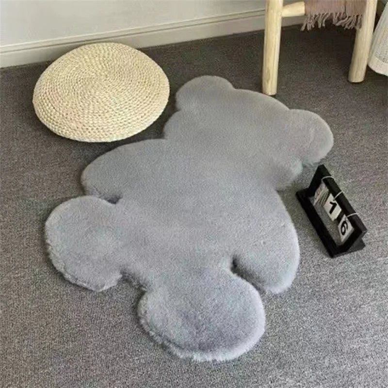 Matt the Bear Rug in a child's bedroom, featuring cozy gray faux fur and playful bear design.