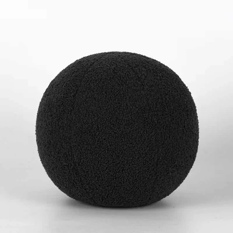Bubble Kiss soft round pillow in luxurious black, perfect for autumn coziness.