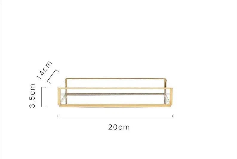 Luxurious Orter tray in brass and glass with gold finish, enhancing home decor.
