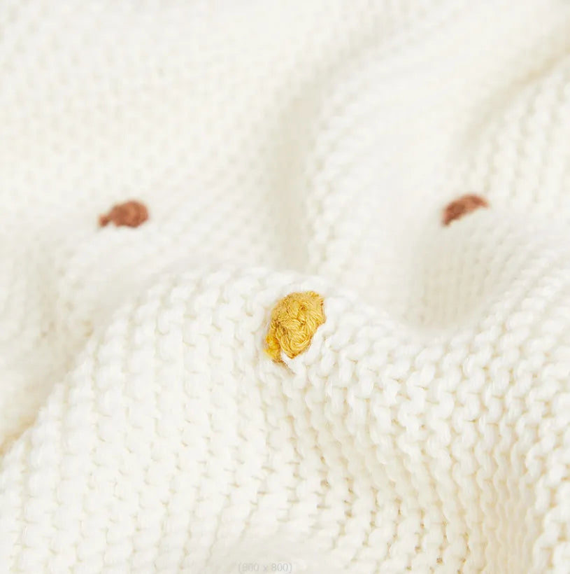 Zion Baby Blanket - soft, luxurious, cream-colored fabric with subtle colorful details.