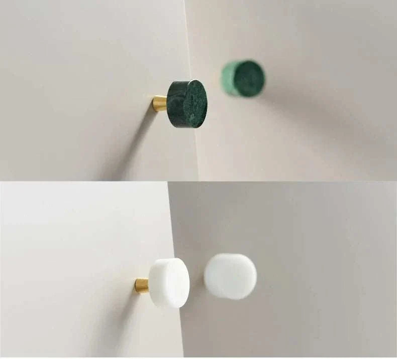 Anessa Handles with brass bases and white and green marble finishes.