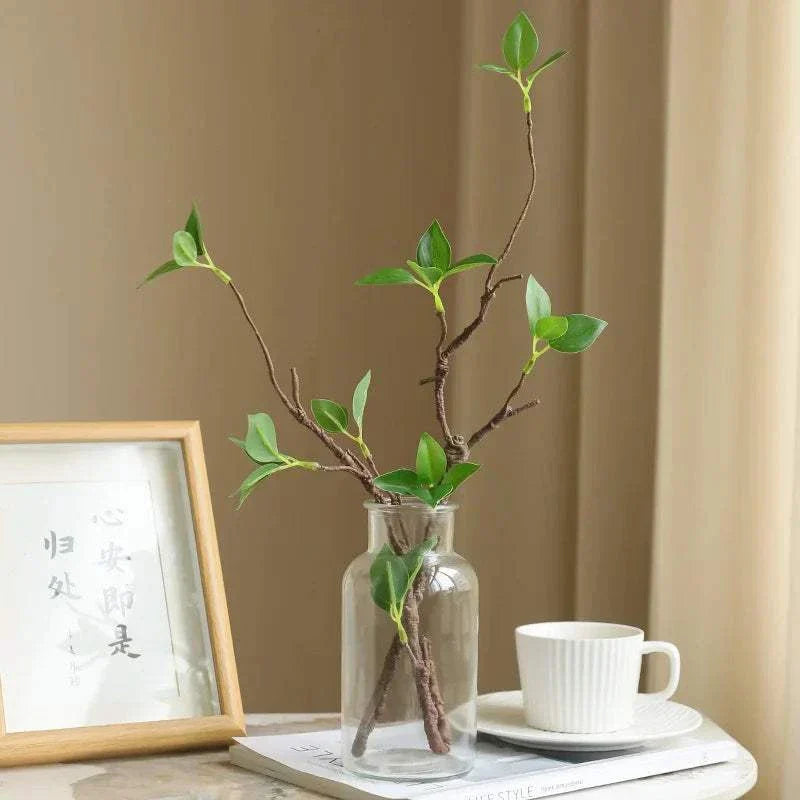 Faux Withered Branches in glass vase with tender buds for home decor.