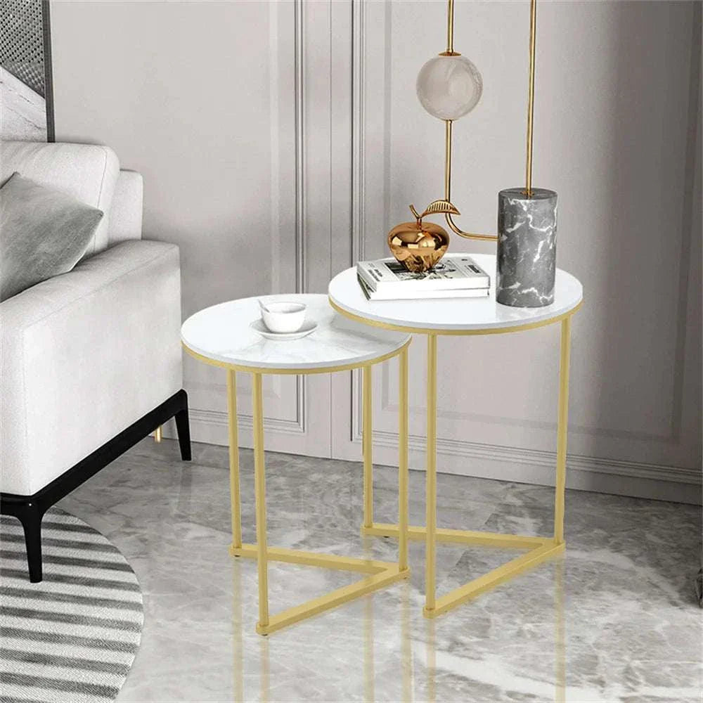 Modern round marble and gold Mariah side table set in living room.