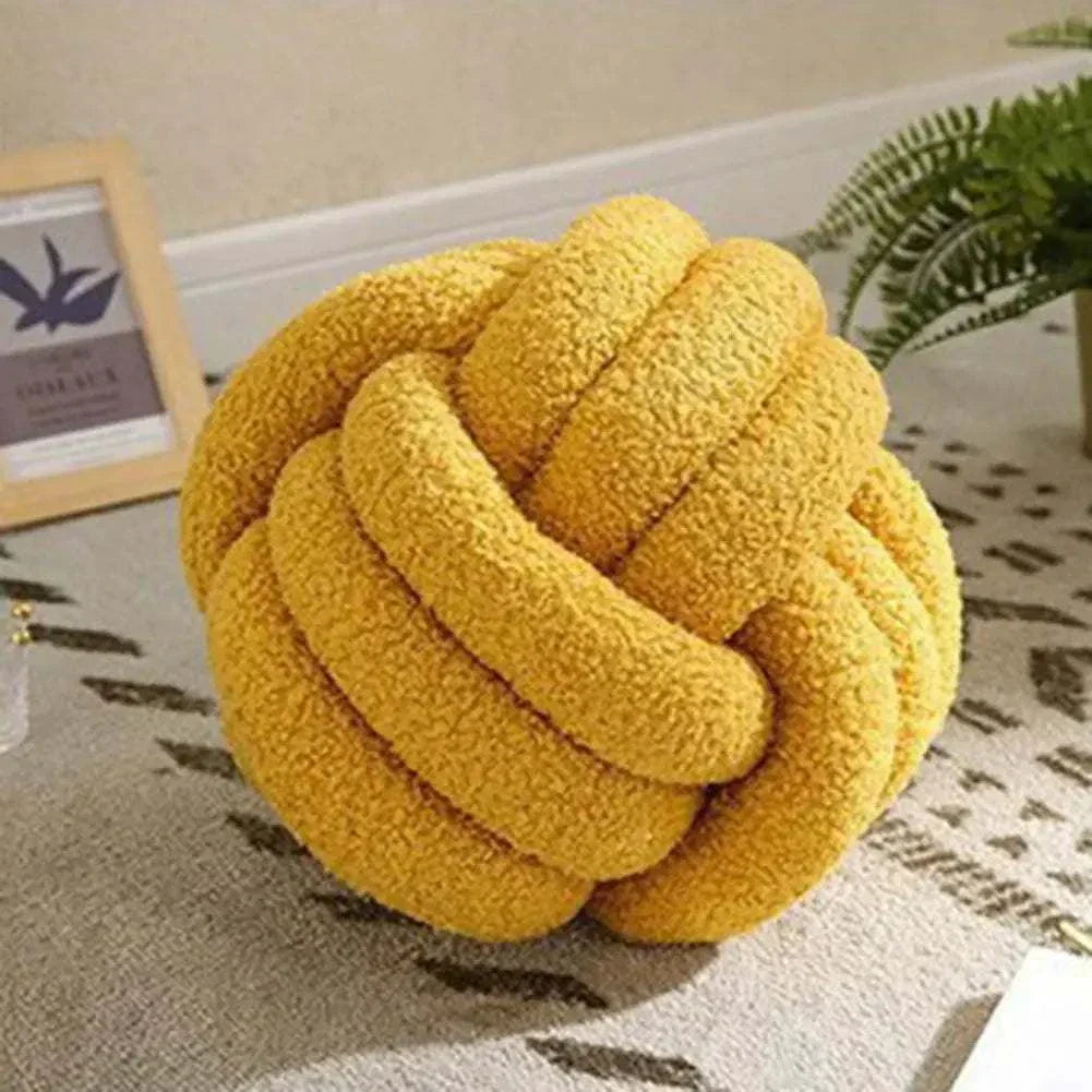 Knotted Ball Pillow in yellow, perfect for kids' room décor and comfort.