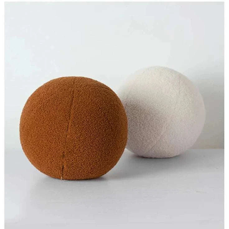 Soft round pillows in brown and cream colors from Bubble Kiss.