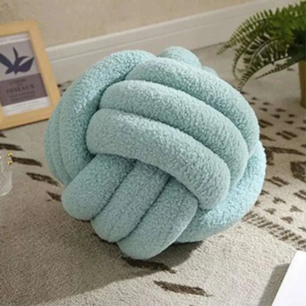 Knotted Ball Pillow for kids' rooms, soft and stylish.