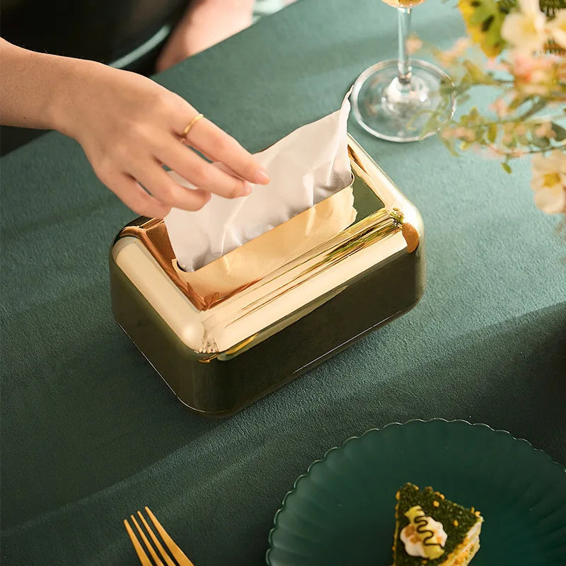 Luxie tissue box with elegant gold finish on table setting.