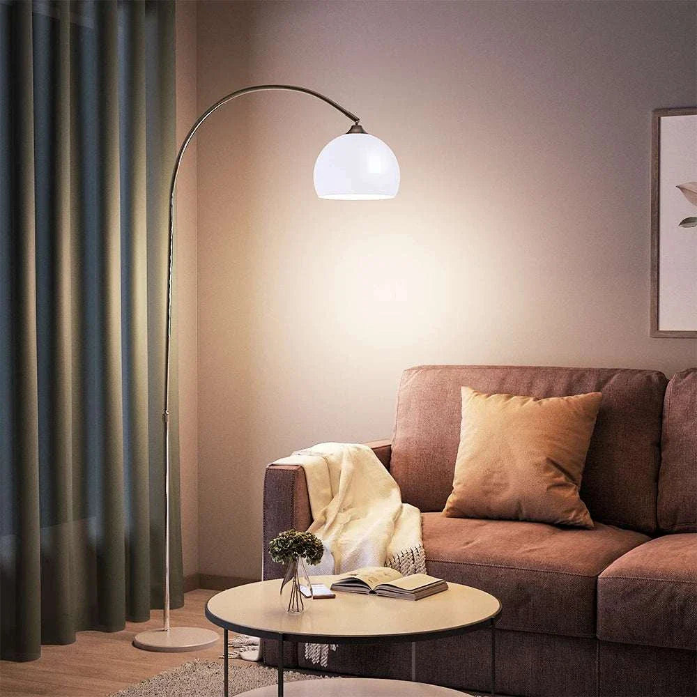 Arched Floor Lamp with chrome finish and marble base in a modern living room setting.